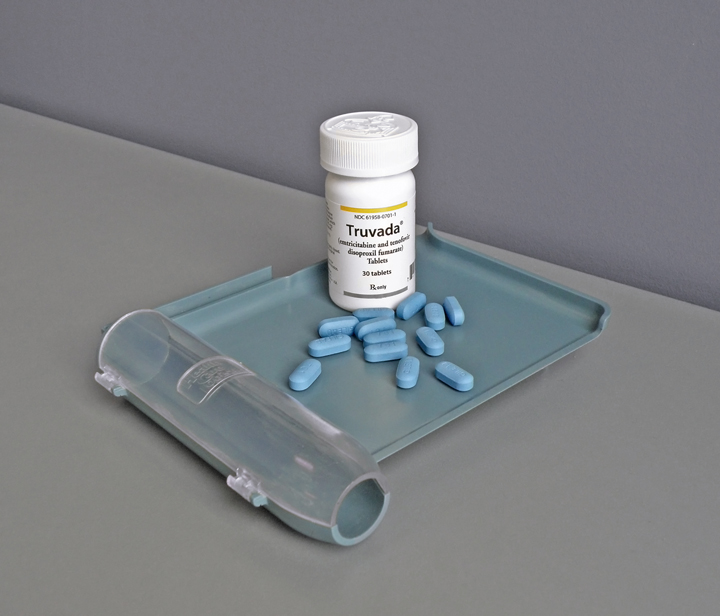 Photo of a Truvada bottle with pills on a pill counting tray