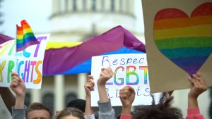 Crowd raising posters chanting to respect LGBT rights